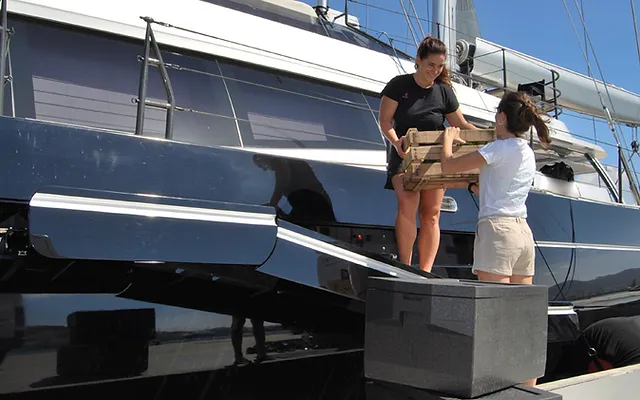 Yacht provisioning crates on dock